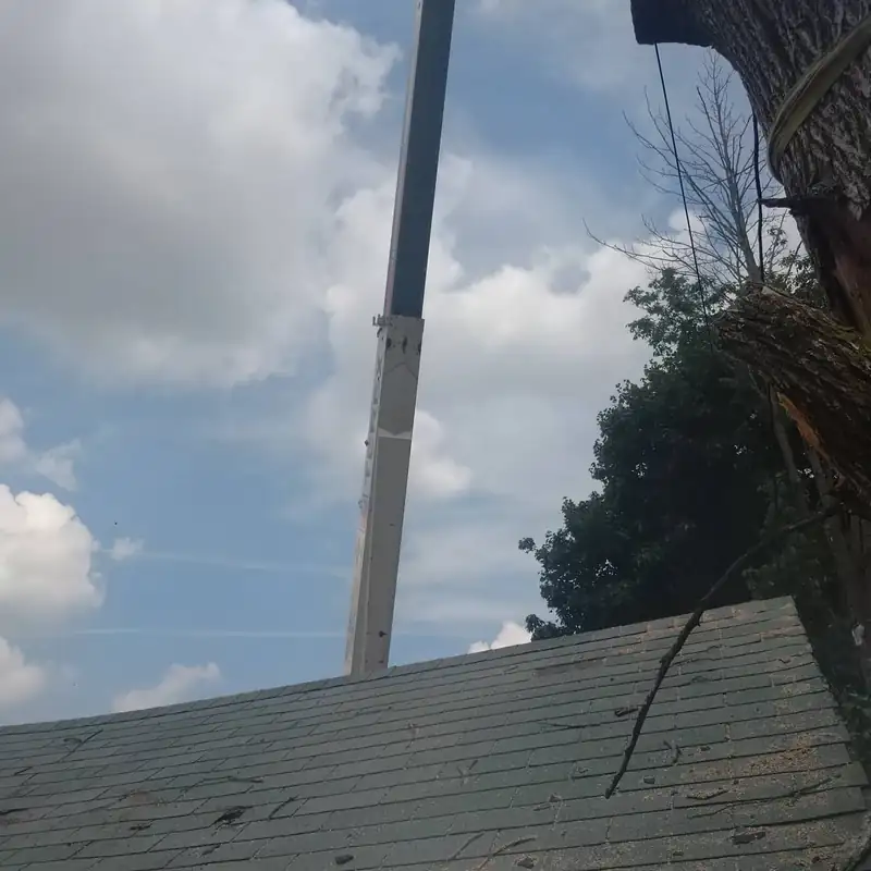 Crane boom positioned above a residential roof